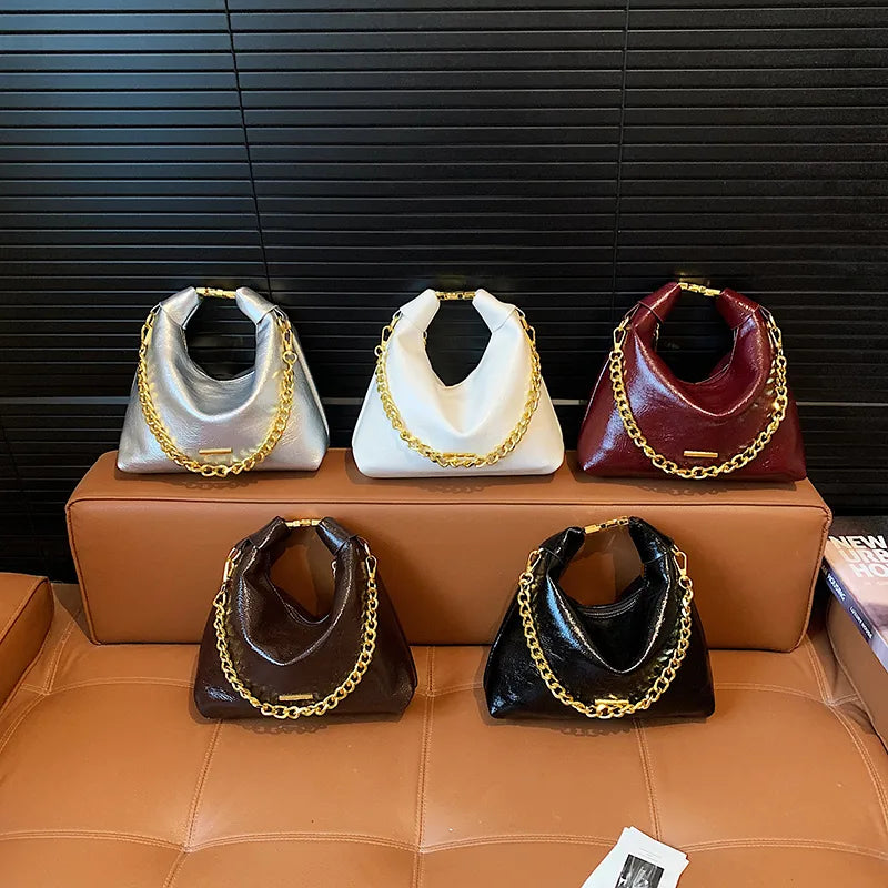 Solid Color Dumpling Shape Shoulder Bag for Women in Artificial Leather with Sewing Thread Detail and Single Shoulder Strap